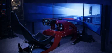 direct drive sim racing rig with triple monitor and ambient LED lighting