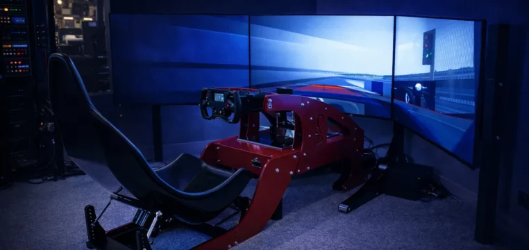 direct drive sim racing rig with triple monitor and ambient LED lighting
