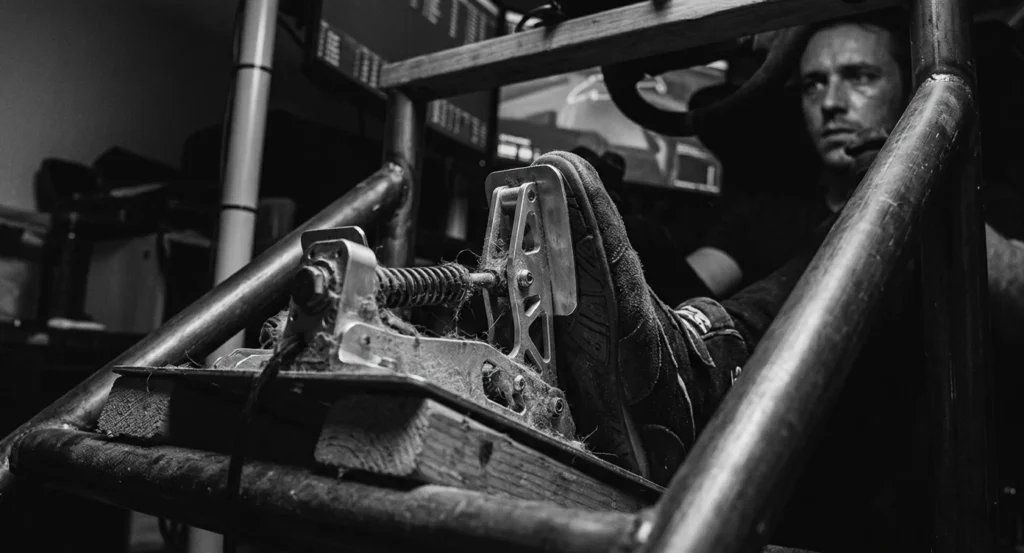 sim racing driver focused on driving inputs and car control instead of hardware upgrades